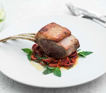 cooked rack of lamb with sweet peppers