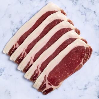  unsmoked back bacon on marble background