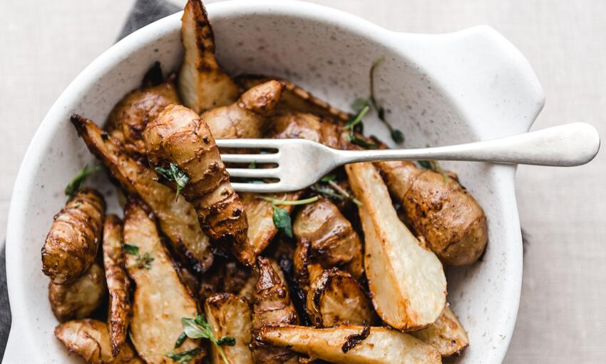 cooked jerusalem artichokes with schmaltz and miso