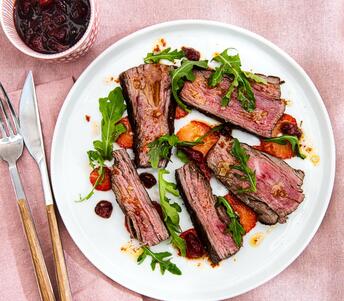 cooked aleppo peppered strawberry relish with grilled steak