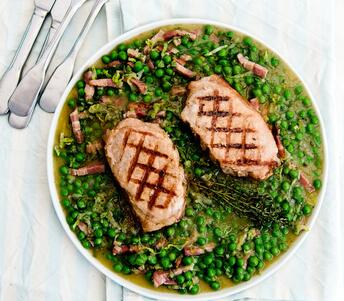 cooked pork loin steak with peas a la françoise