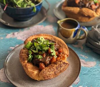 cooked ox cheeks on yorkshire puddings