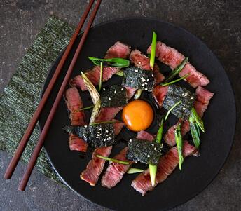 rump steak with soy cured egg and seaweed cooked