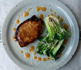 honey and miso glazed pork steaks with ginger pak choi cooked