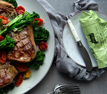 charred lamb chops garlic rosemary and mint butter cooked