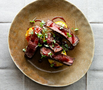 coffee rubbed rib eye steak & bourbon sauce cooked