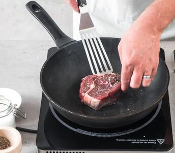 rib eye steak on pan 
