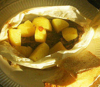 skopelos lamb with bread in paper parcels